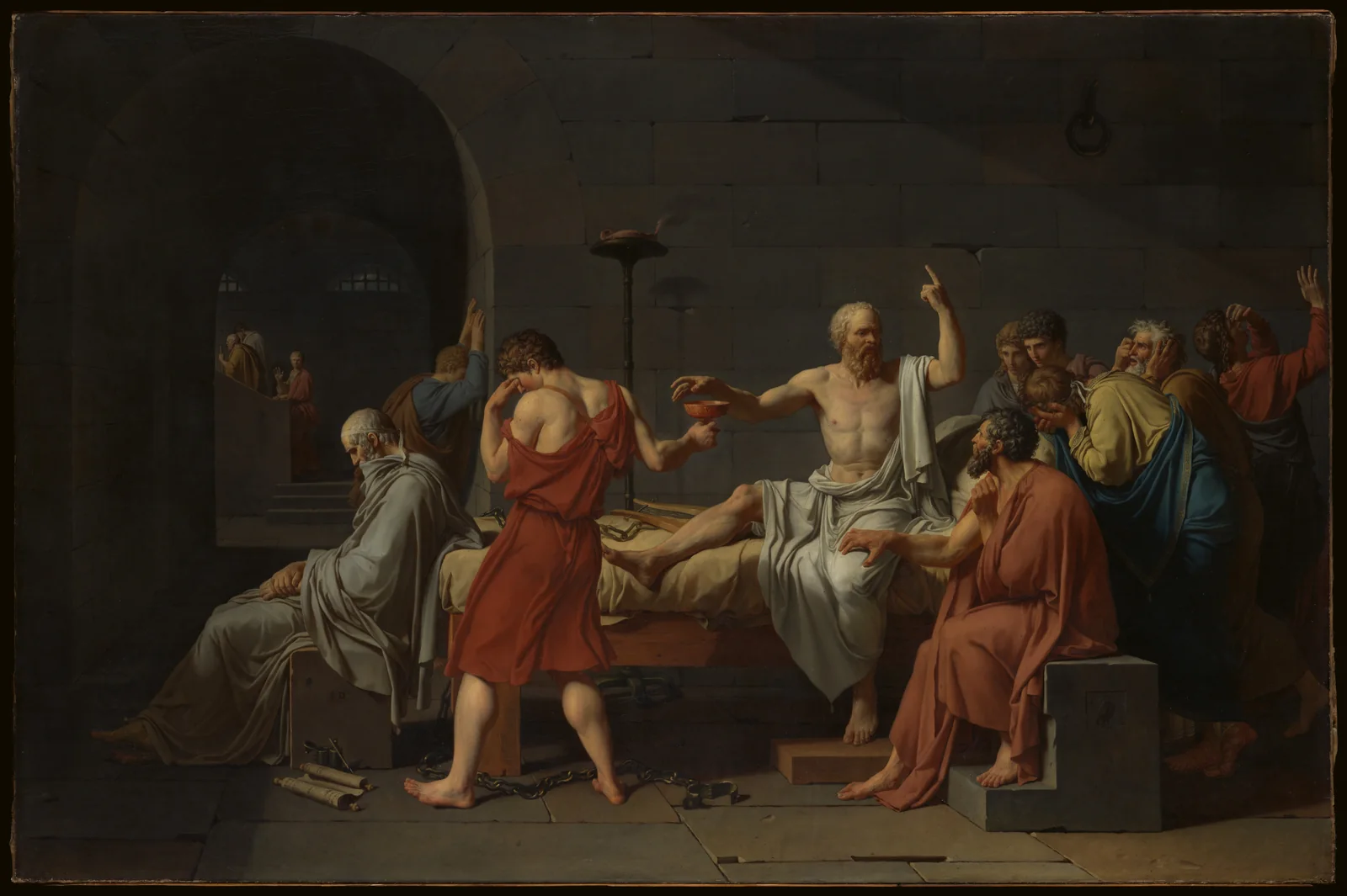 Socrates raises one hand and reaches toward a cup while grieving companions gather around his bed.